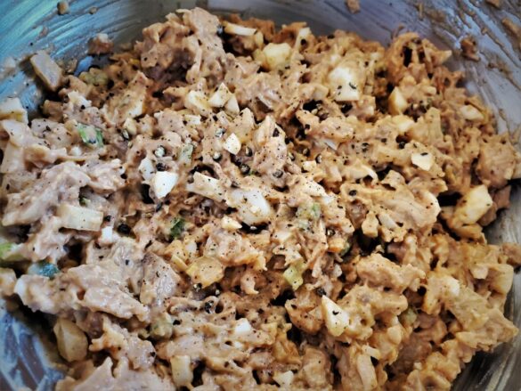 A picture of BBQ chicken salad in a bowl.