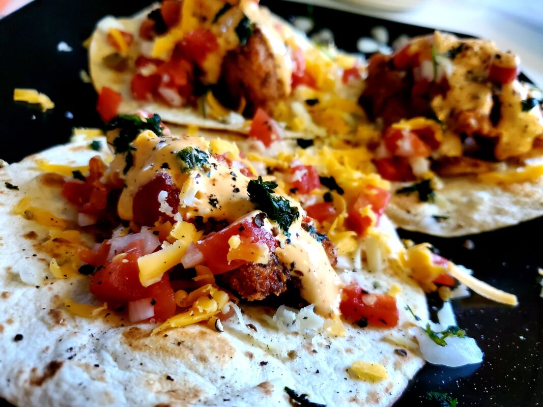 A picture of fish tacos on a plate.