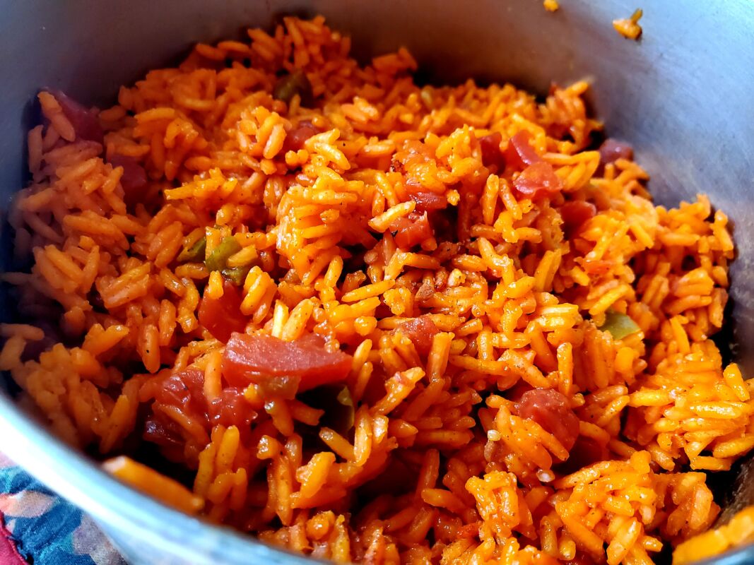A picture of a pot of homemade Spanish rice.