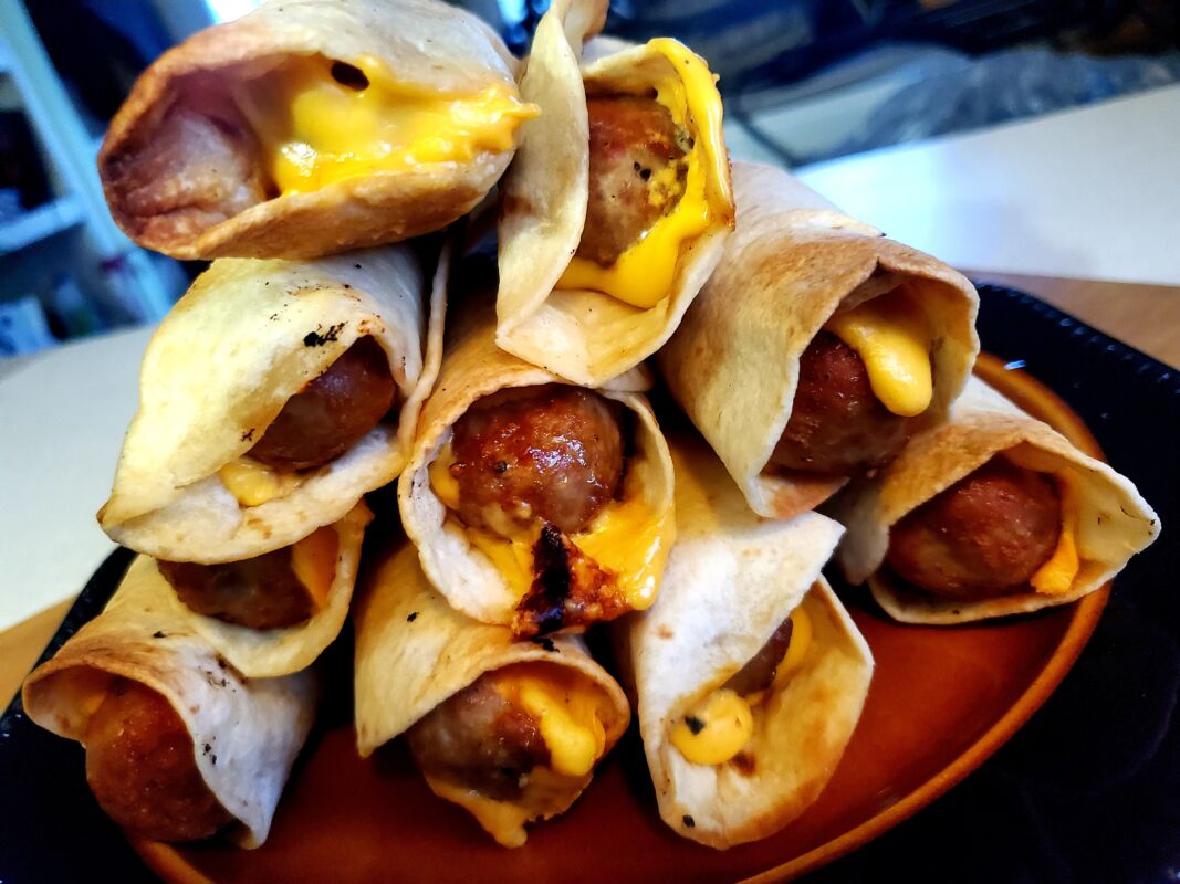 a pile of turkey sausage crispy dogs on a plate